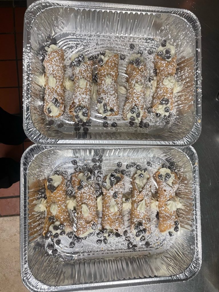 Trays of cannoli from Tolli's Apizza
