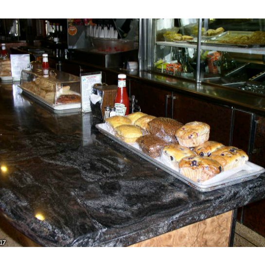 A tray of large muffins on the counter at Twin Pines Diner